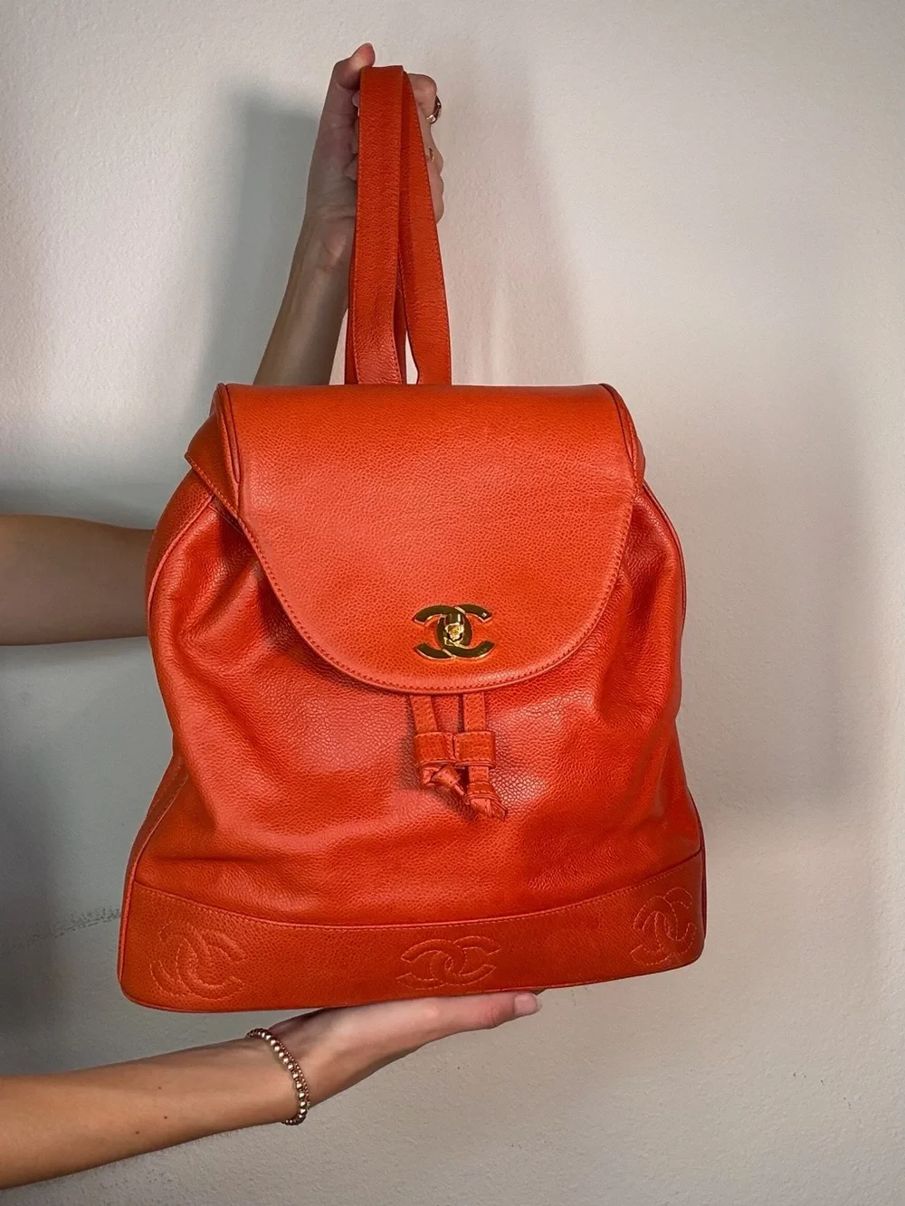 CHANEL Orange Caviar Leather Backpack with CC Trim and Gold Hardware